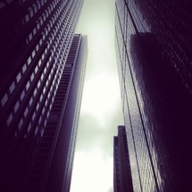 looking up between skyscrapers