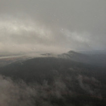 fog and clouds over a mountain range