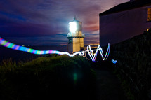 light from a lighthouse and streaks of light 