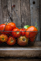 tomatoes in a wire basket 