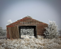 old barn in winter snow 