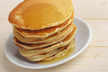 stack of pancakes with honey 