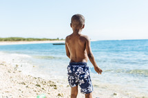 a boy child on a beach 