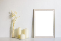 blank frame and candles 