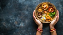 Traditional Indian Thali served on a brass plate, overhead view. Concept of Indian cuisine, culture, and festival.