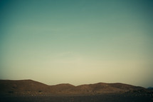 Mountain range on the horizon in Sultanate of Oman.