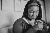 African-American woman with praying hands
