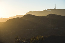 sunlight shining over Hollywood sign 