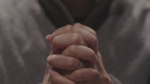 a man with praying hands 