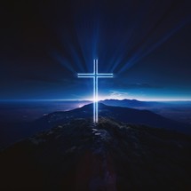 Cross on the top of the mountain. Conceptual image for faith, spirituality and religion.
