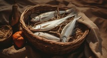 "Feeding the multitude". Fishes in a wicker basket on a brown background.