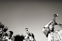 School bandmates playing trumpet marching band high school music brass