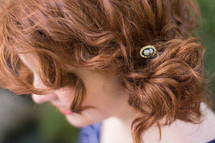 barrette in a redhead's hair 
