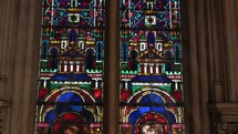 Illuminated stained glass apostles.
