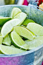 A bucket of lime slices fresh
