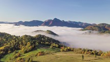 Aerial time lapse of foggy autumn mountains landscape.