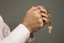 man holding a rosary 