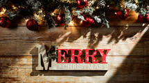 Merry Christmas sign with decorations background