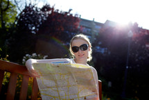 Girl reads the map outside