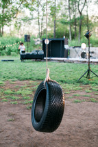 a tire swing by a concert stage 