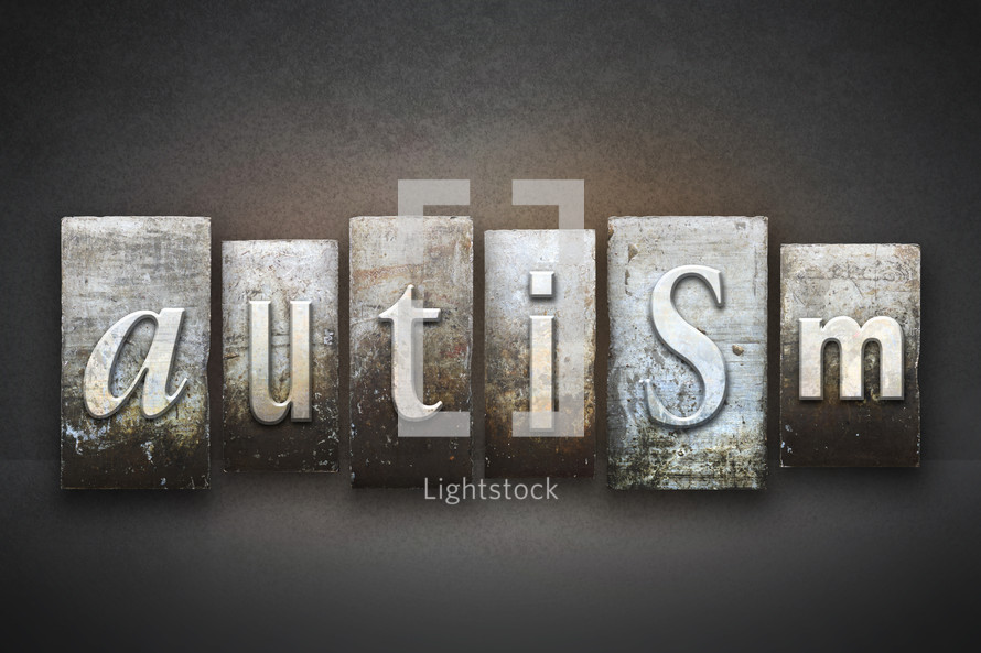 Stone tiles spelling the word autism.