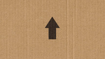 black arrow on cardboard 