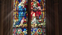 Stained glass window with angelic figure.