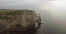 Aerial view of cliffs of Etretat at sunset. 