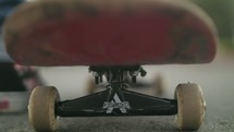 Close up of a person getting on a skateboard and riding away