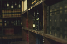 liquor and books on a bookshelf 