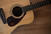 acoustic guitar on wood 