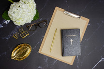 Bible and clipboard 