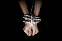 bound wrists in rope 