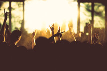 silhouettes of people in an audience at a concert 