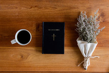 coffee cup, bouquet of dried flowers and Bible 
