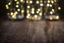 bokeh light from Christmas trees and a wood floor 