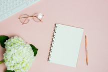 hydrangea, pink desk, notebook, and pen 
