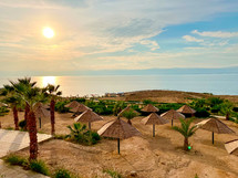 Dead Sea Beach Vacation Resort with Umbrellas in Jordan.