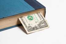 dollar bookmark in a book 