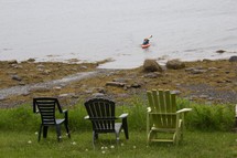 Adirondack chairs overlooking the ocean 