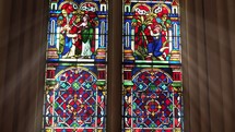 Church window depicting holy figures.
