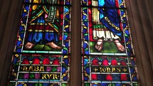 Stained glass windows of biblical scenes 