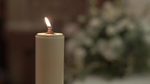 Detail of church decoration with candle during wedding.