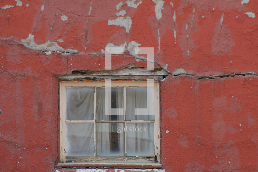 window and a crack in a wall 