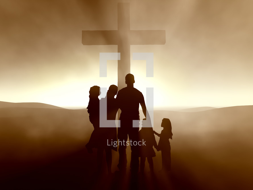 Silhouette of a family around the cross at dusk.