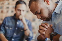 men in prayer at a Prayer group