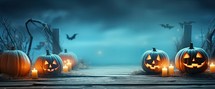 Halloween pumpkins with candles on wooden background, 3d render