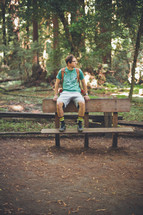 man sitting on a park bench 