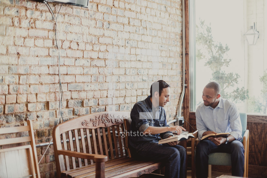 men reading a Bibles at a Bible study 