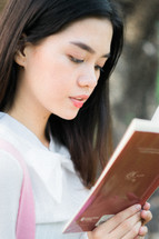 a woman reading a book 